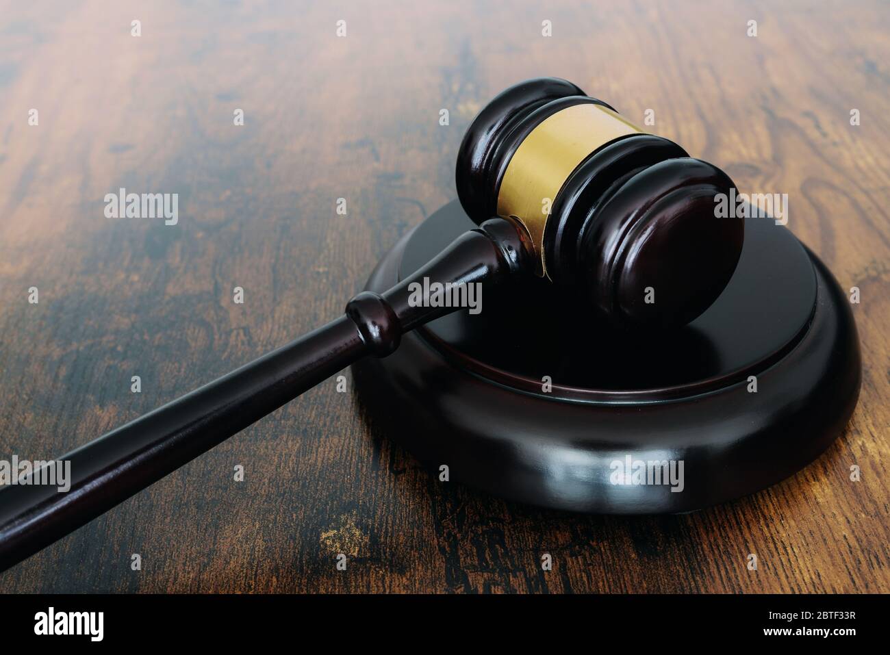 close-up of judges gavel or auction hammer on wooden table Stock Photo