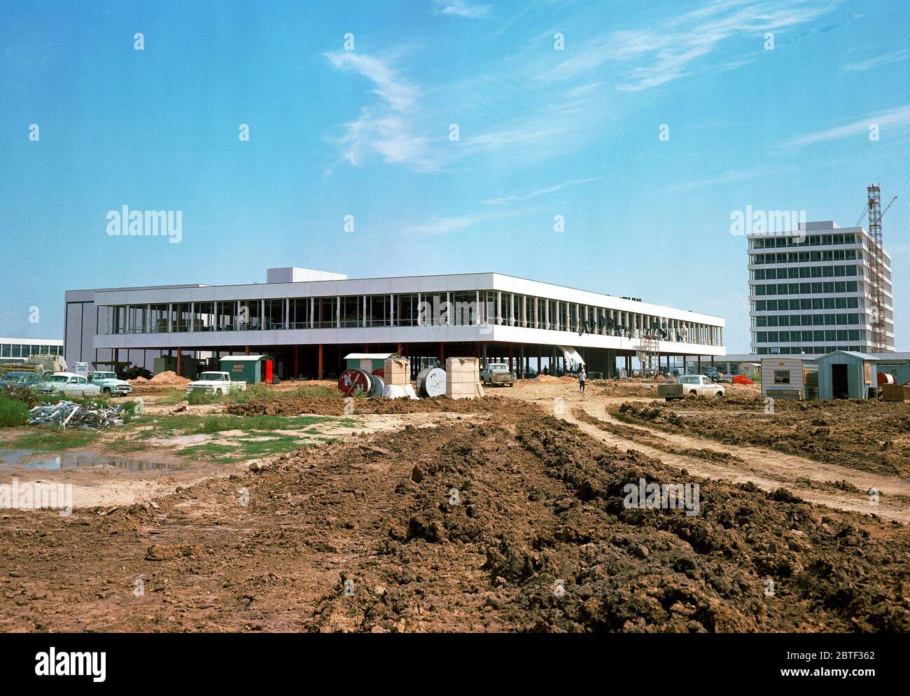(25 Sept. 1963) --- This easterly view documents early construction of the Manned Spacecraft Center in September of 1963.  The Avionics Systems Laboratory (Building 16) is in the foreground and the Project Management Building is see in the right background. Stock Photo