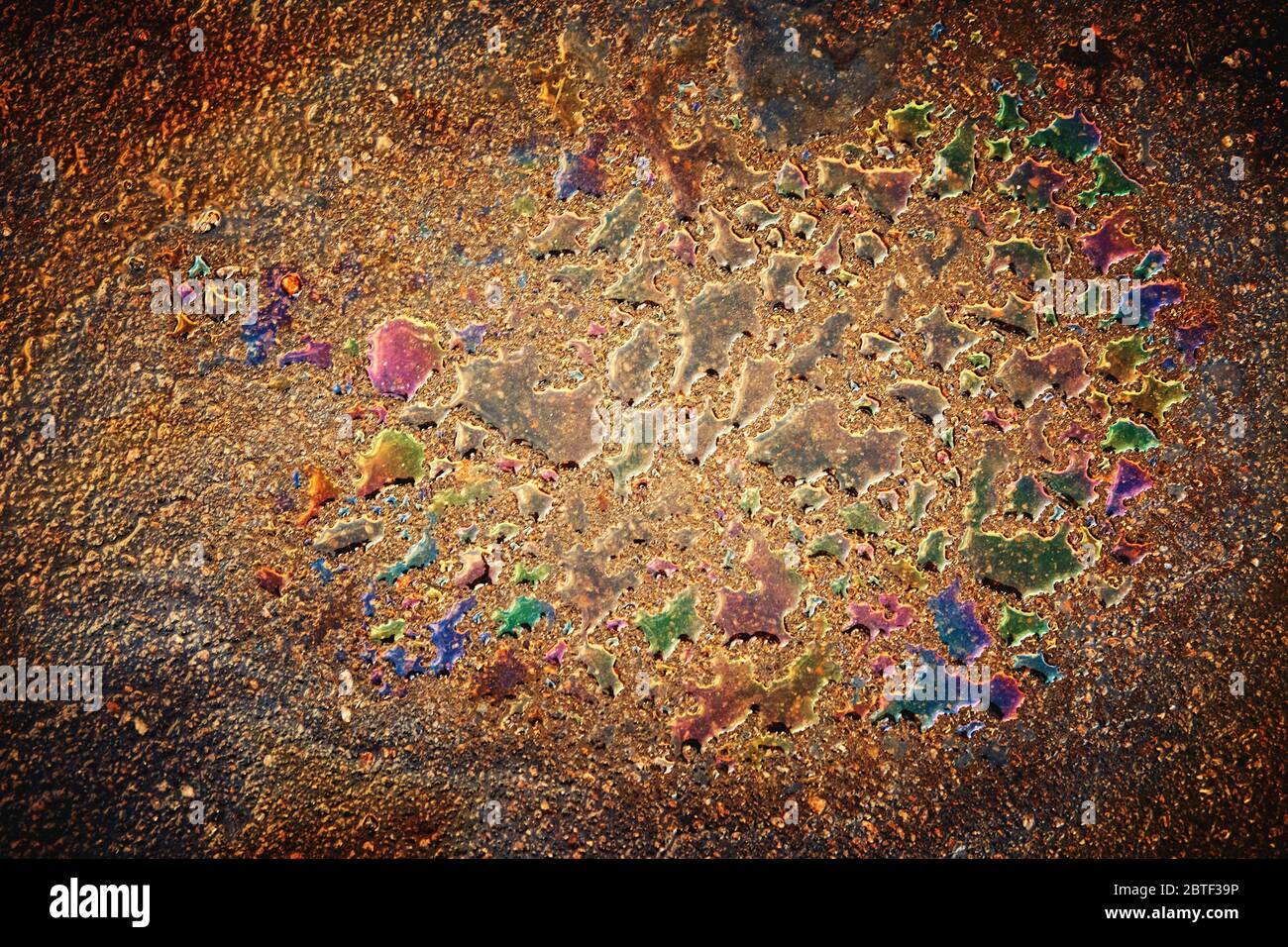 Oil stain on Asphalt road after rain. Industry, black.Abstract closeup background Stock Photo