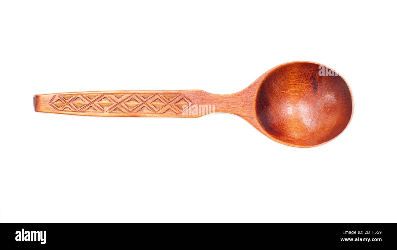 Old wooden spoon isolated on white background, top view Stock Photo