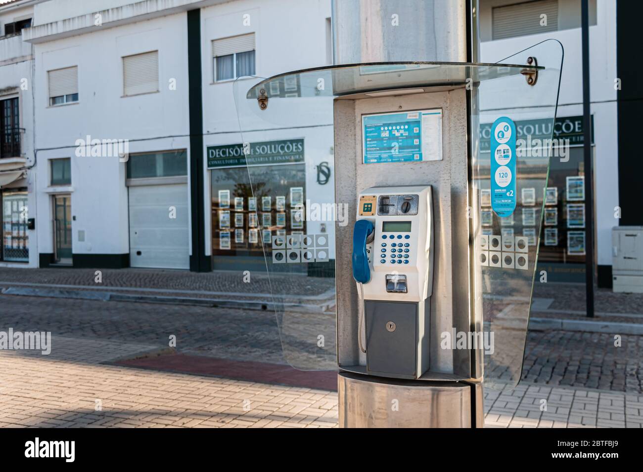 Tavira, Portugal - April 30, 2018: Old public telephone booth in the city center on a spring day Stock Photo