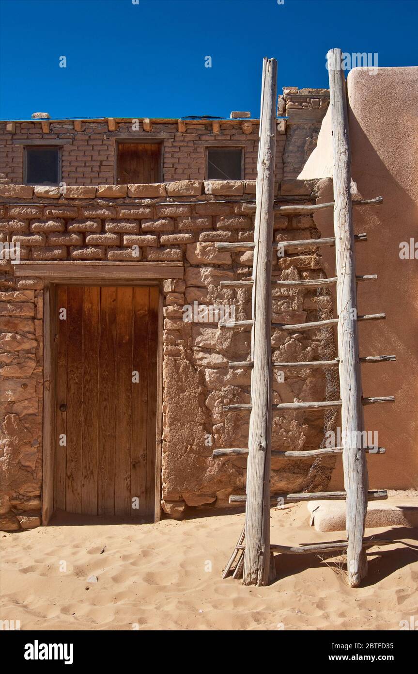 Wooden ladder on a dwelling in Acoma Pueblo (Sky City), Native American pueblo on top of a mesa in Acoma Indian Reservation, New Mexico, USA Stock Photo