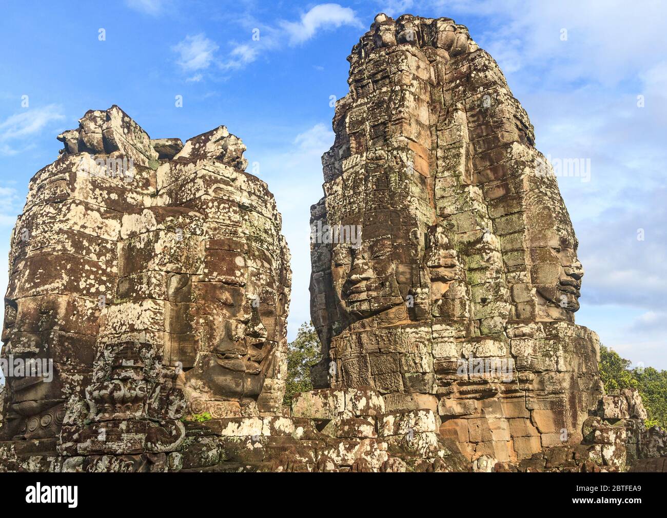 The Bayon temple is a richly decorated Khmer temple at Angkor in Cambodia. Built in the late 12th century or early 13th century Stock Photo