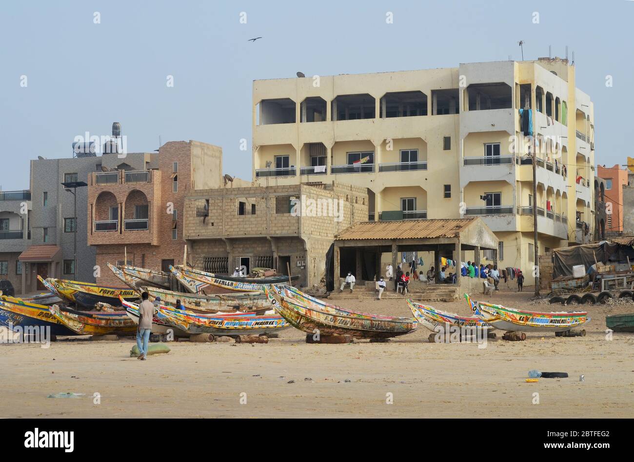 Pirogues (artisanal fishing boats) at their landing site in Yoff beach, Dakar, Senegal Stock Photo