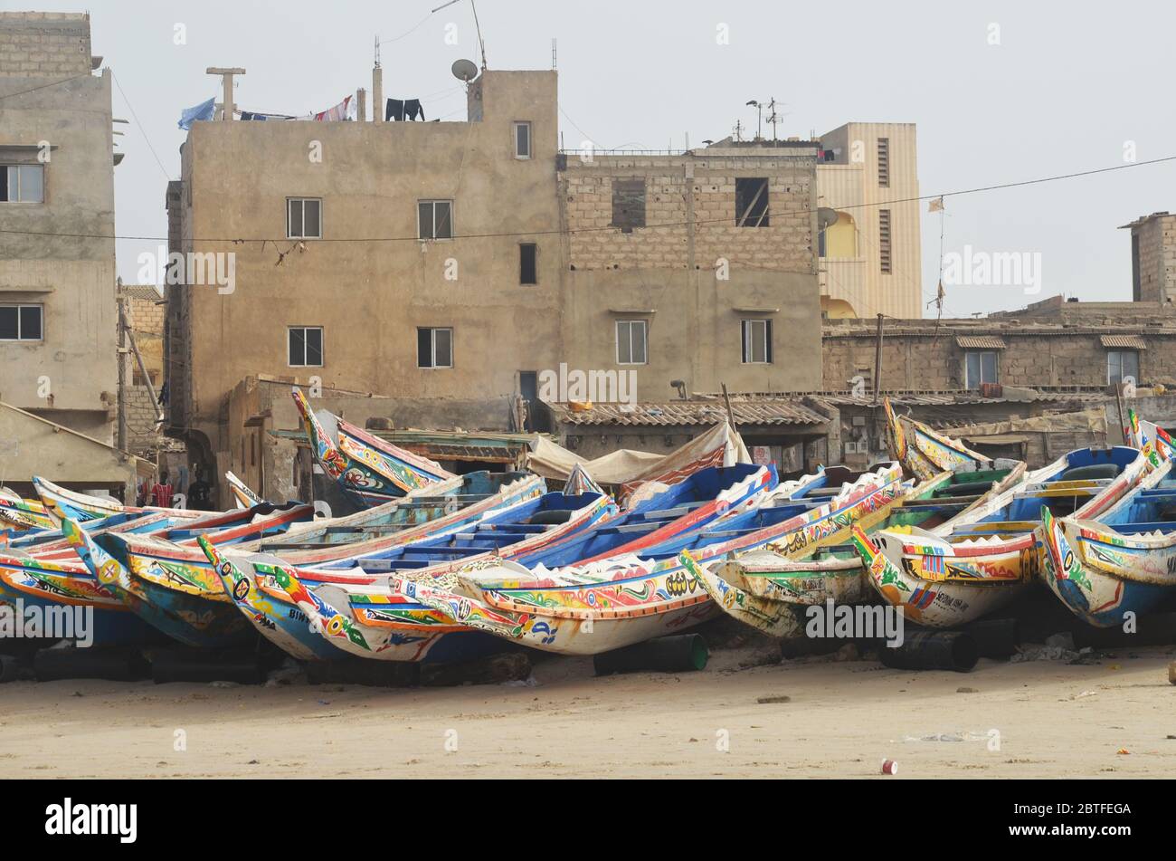 Pirogues (artisanal fishing boats) at their landing site in Yoff beach, Dakar, Senegal Stock Photo