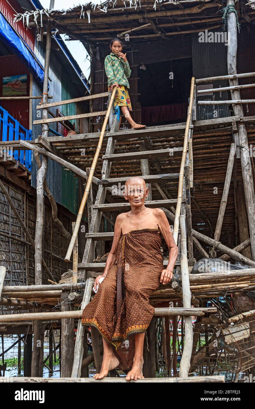 Elderly woman and her granddaughter in Kompong Pluk (Phluk), a cluster of three villages made of stilt houses within the floodplain of the Tonle Sap Stock Photo