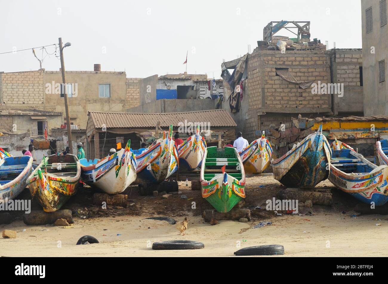 Pirogues (artisanal fishing boats) at their landing site in Yoff beach, Dakar, Senegal Stock Photo