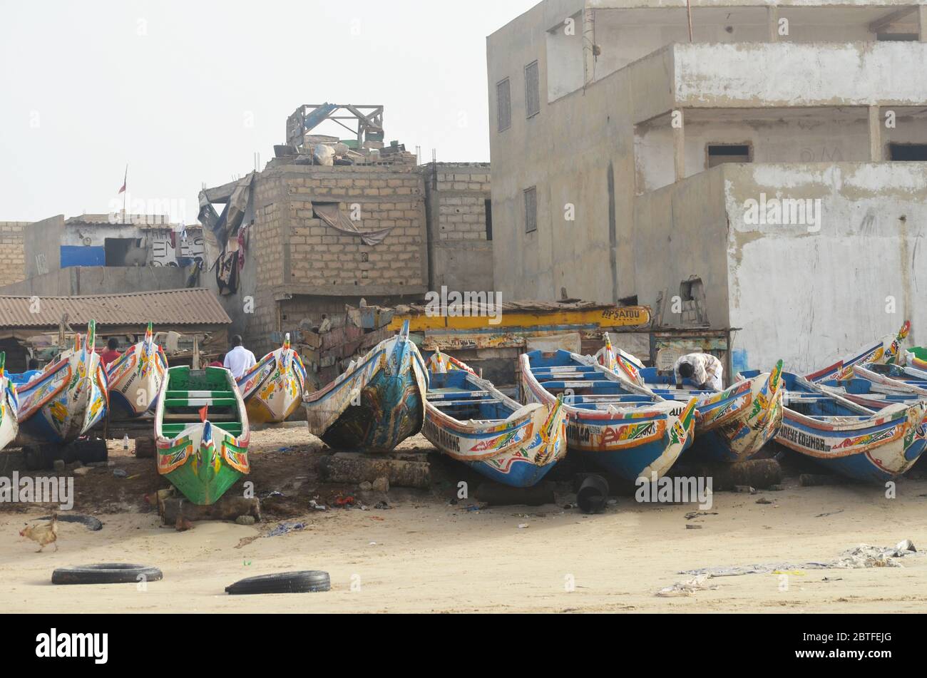 Pirogues (artisanal fishing boats) at their landing site in Yoff beach, Dakar, Senegal Stock Photo