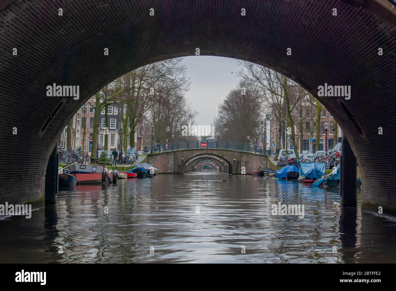 A bridge over the narrow canals of Amsterdam in Holland Stock Photo Alamy