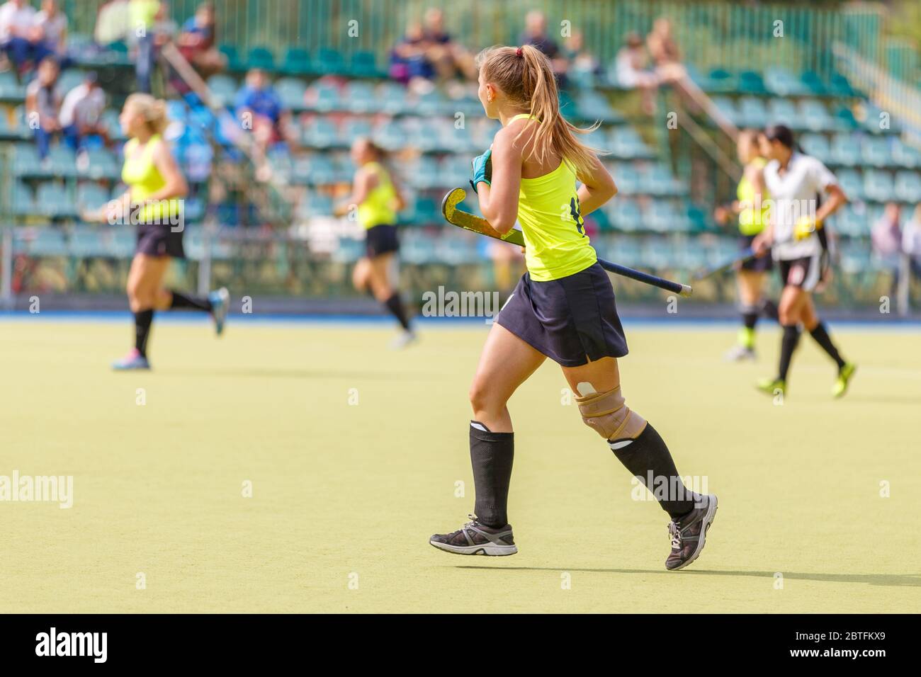 Female field hockey player in the game Stock Photo Alamy