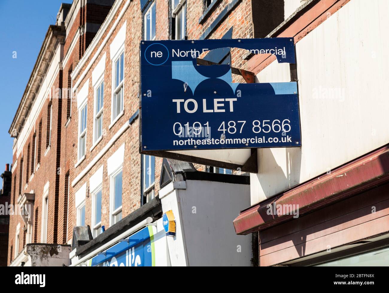 The empty shops on the West side of the High Street in Stockton on Tees,England,UK. To Let sign in close up Stock Photo