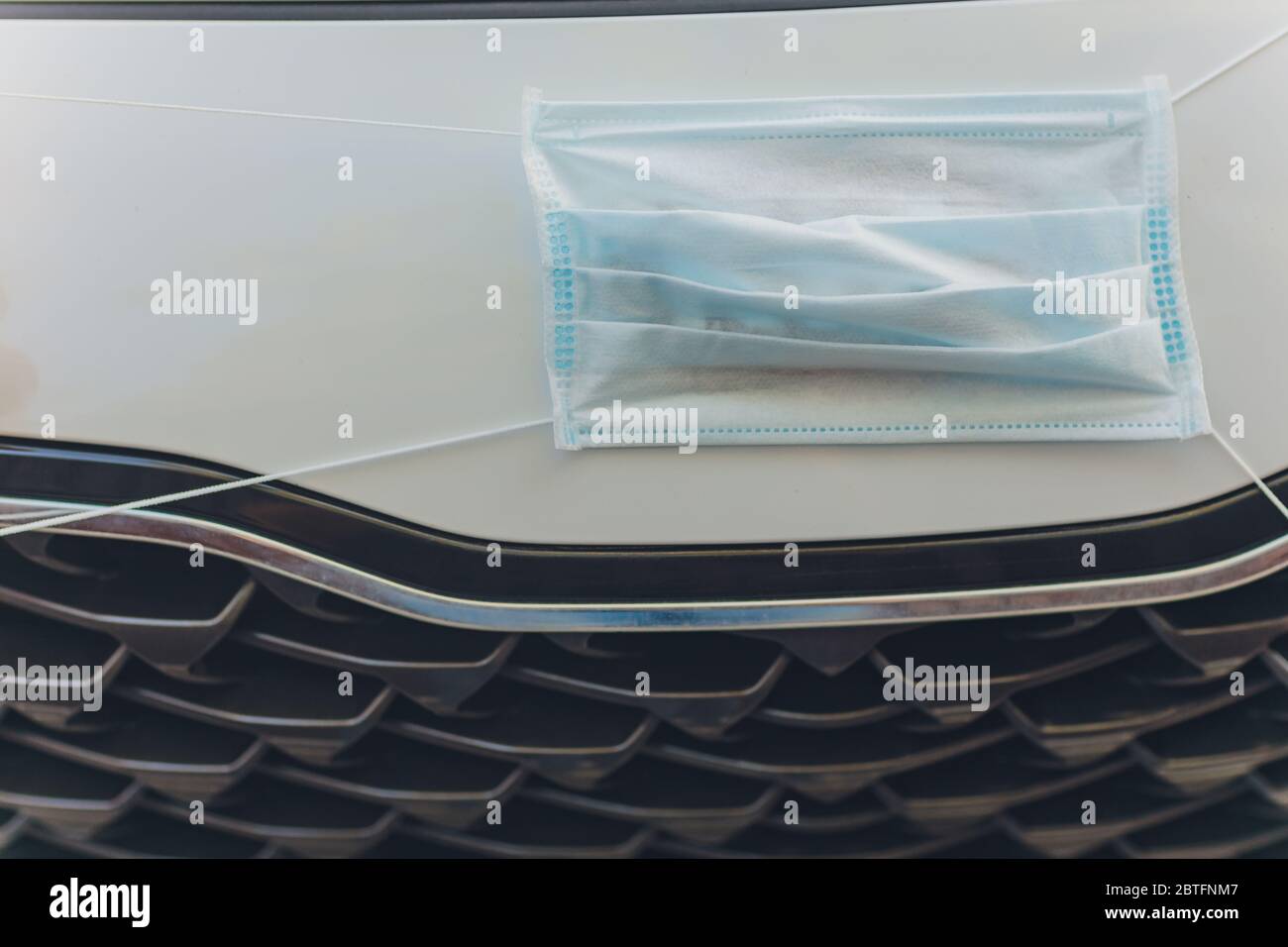 The medical mask in the car, virus concept Stock Photo - Alamy