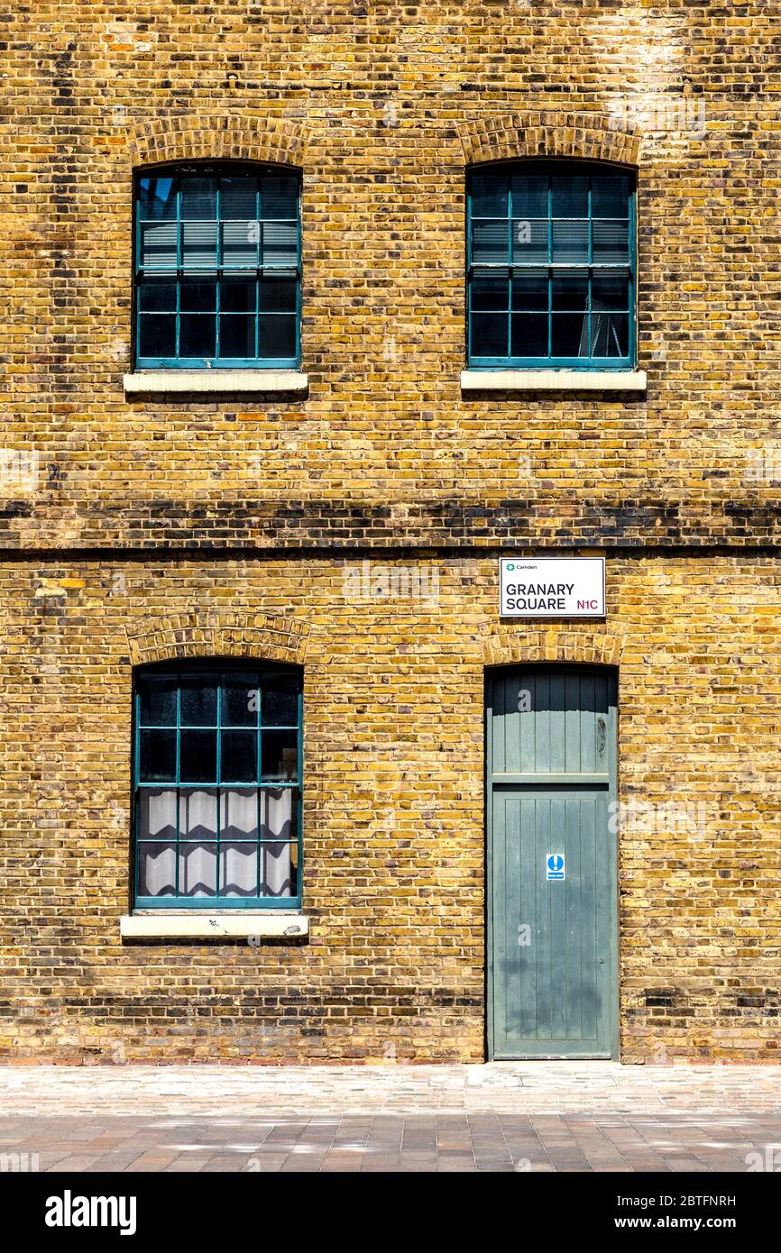 Facade of Central Saint Martins University of the Arts campus in Granary Square, previously a granary storehouse for wheat, Kings Cross, London, UK Stock Photo