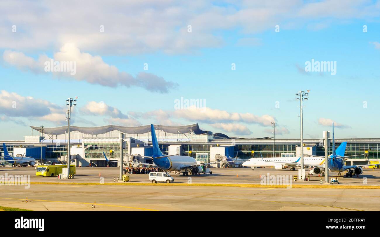 Boryspil airport panorama, airplanes, bus and passengers queue at airfield. Kyiv, Ukraine Stock Photo