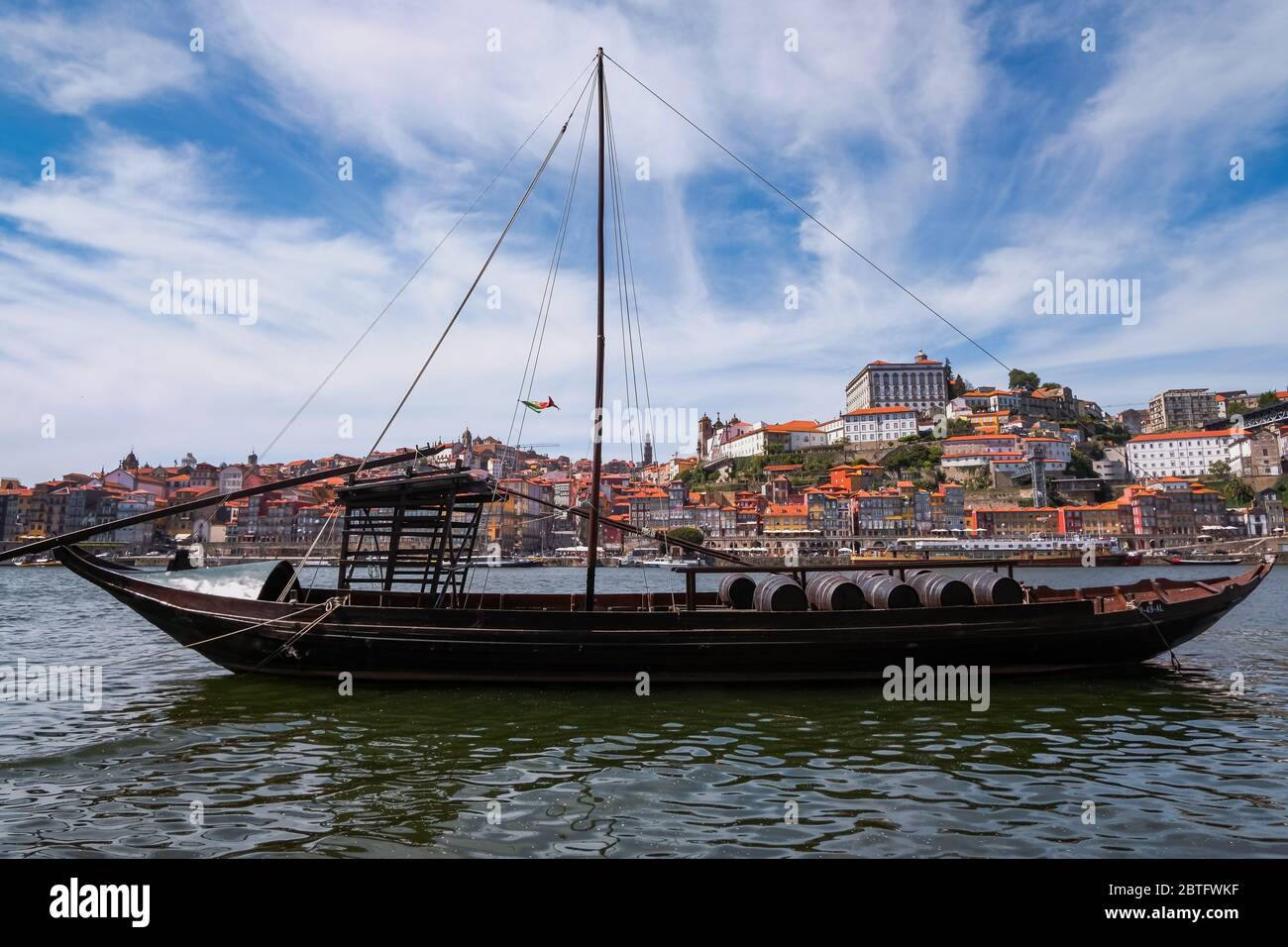 Rabelo Boats in Douro River - Port Wine, Dom Luís I Bridge - Iron, Double Decker, Ribeira Disctrict, Colourful Traditional Houses Stock Photo