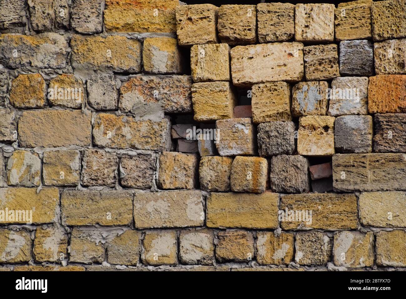 a shadow from the blocks of limestone shell. Wall texture background Stock Photo
