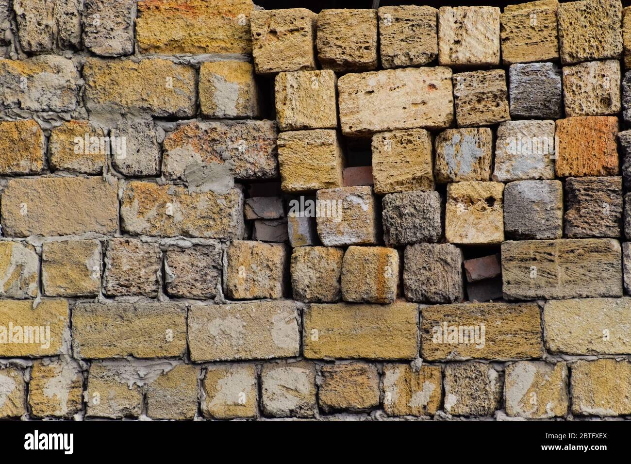 a shadow from the blocks of limestone shell. Wall texture background Stock Photo