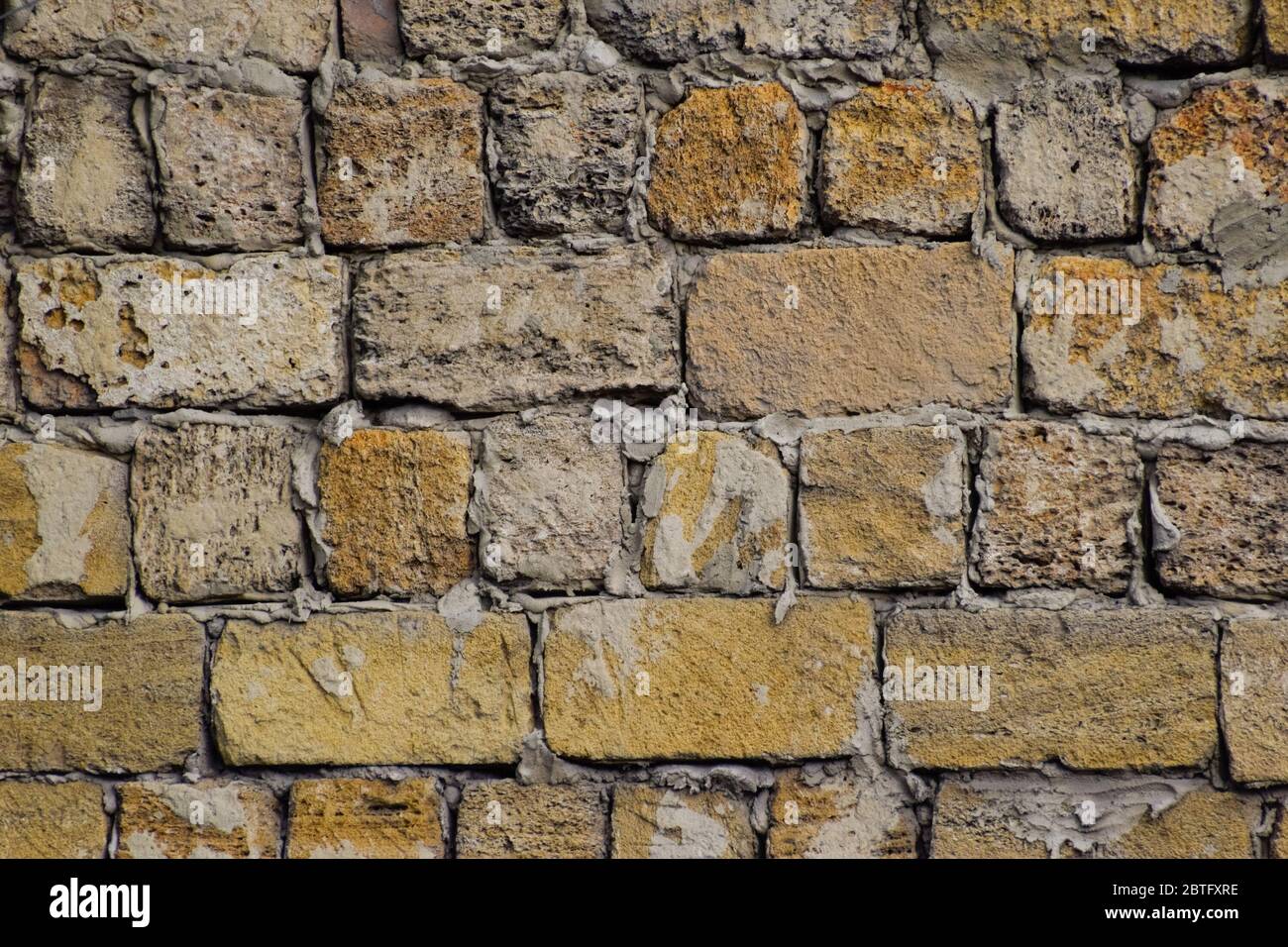 a shadow from the blocks of limestone shell. Wall texture background Stock Photo