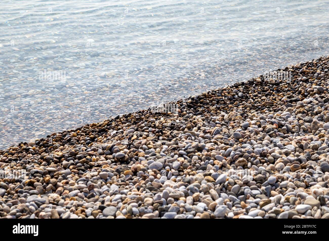 Natural background seashore and stones, pebble sea wave, landscape for calm Stock Photo