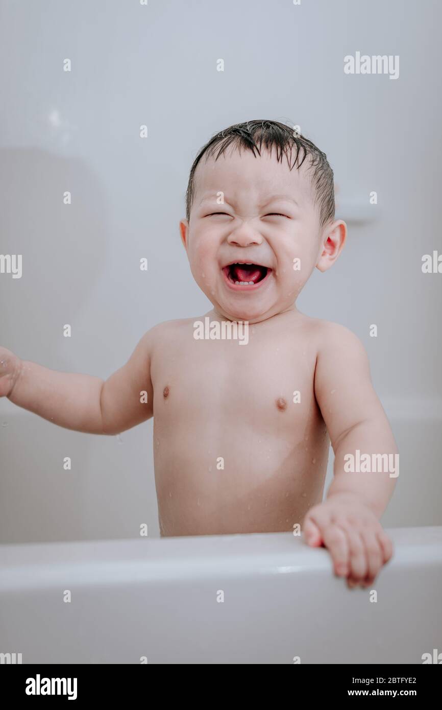 Little baby boy, playing in bathtub at home Stock Photo Alamy