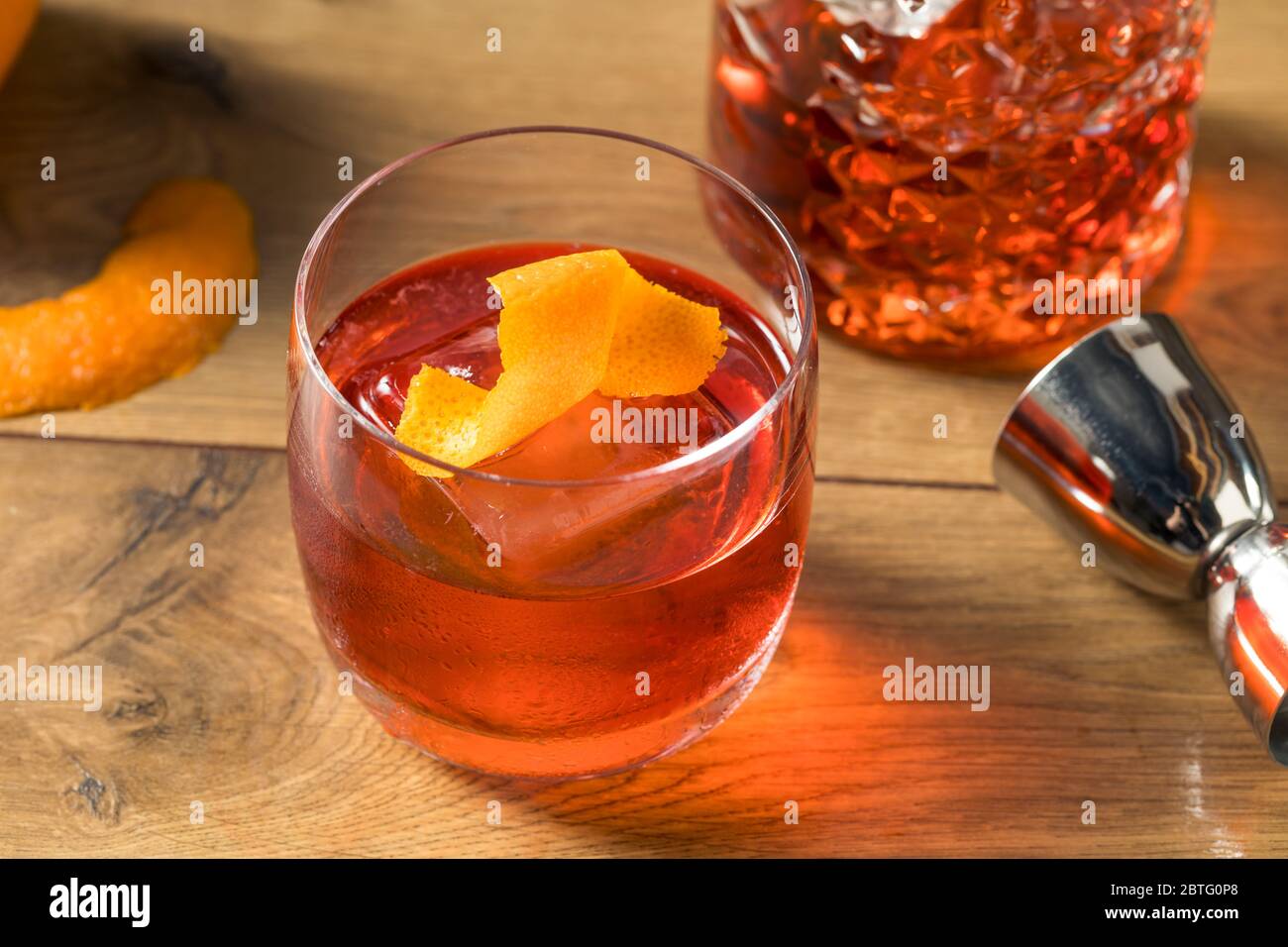 Refreshing Boozy Gin Negroni Cocktail with Orange Garnish Stock Photo
