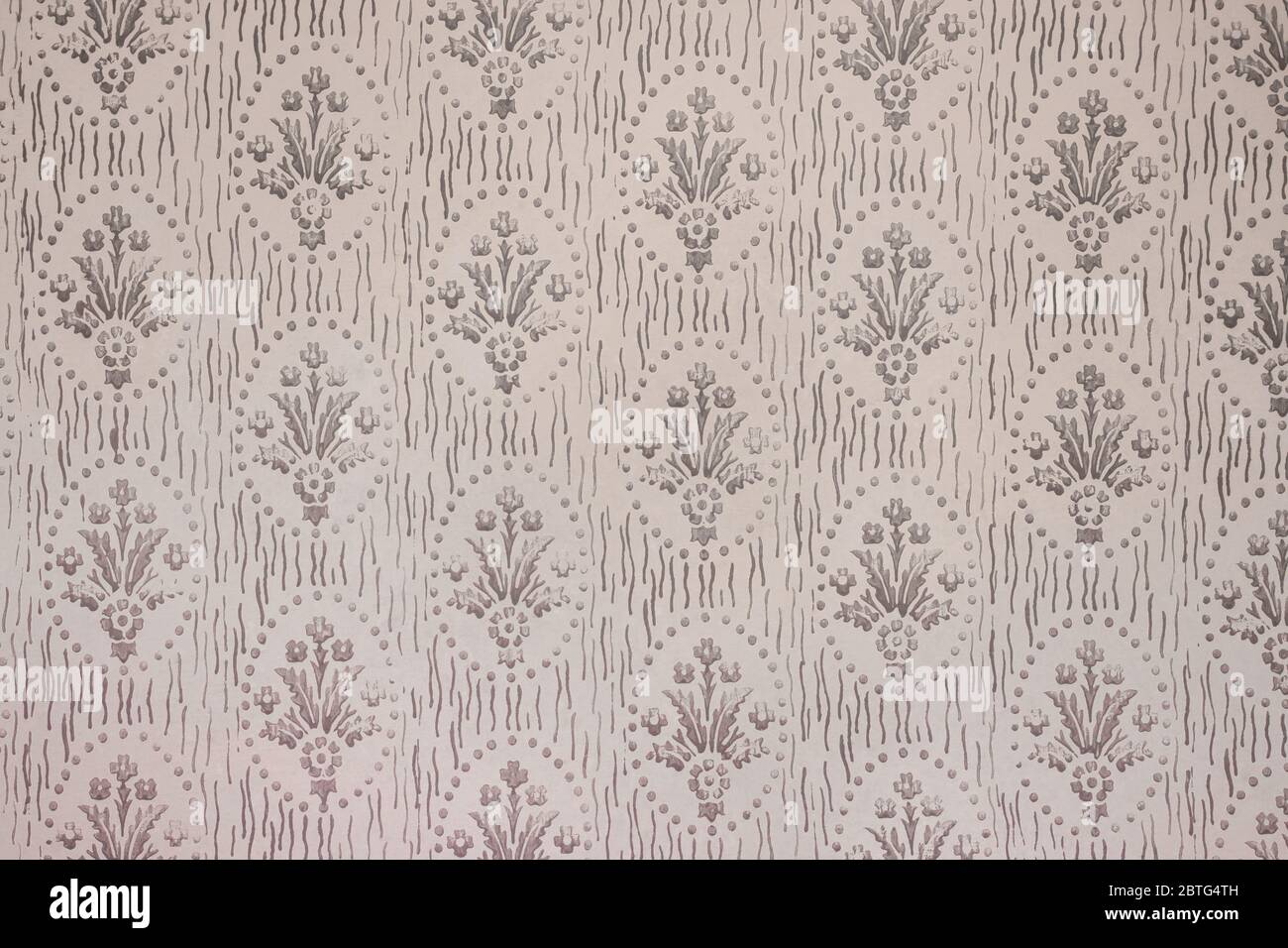 Retro style floral ornament background on the old wall. Stock Photo