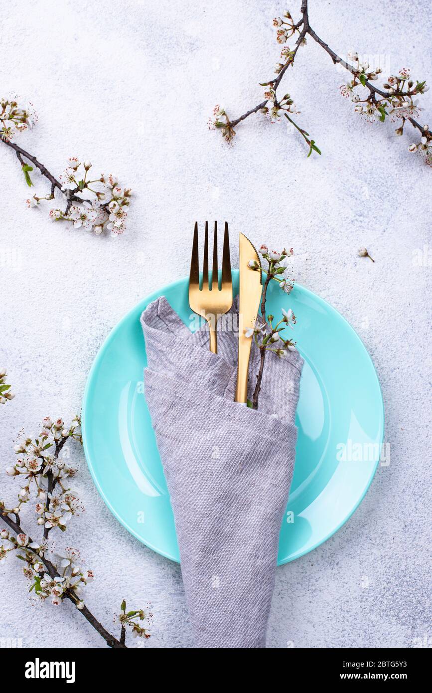Spring table setting with blooming branch Stock Photo
