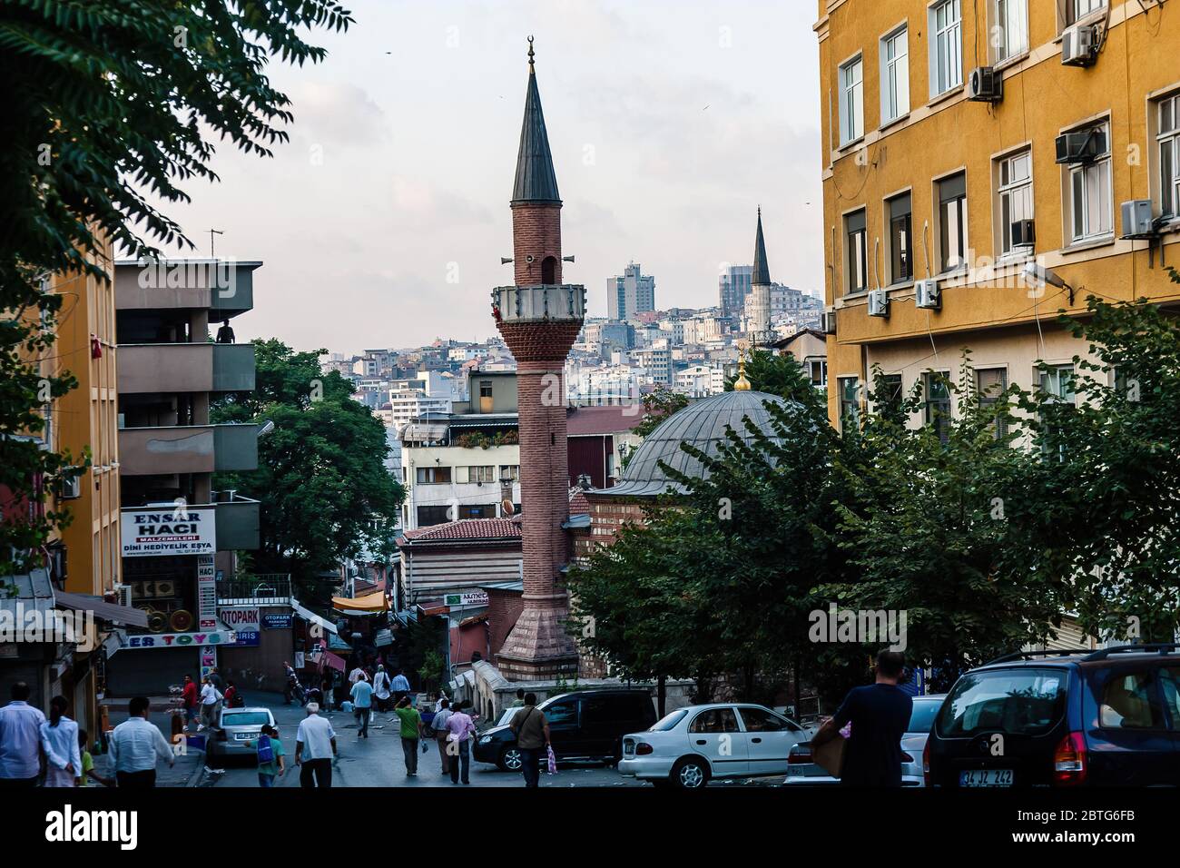 A small street with shops and a mosque in Eminonu District, Istanbul Stock Photo
