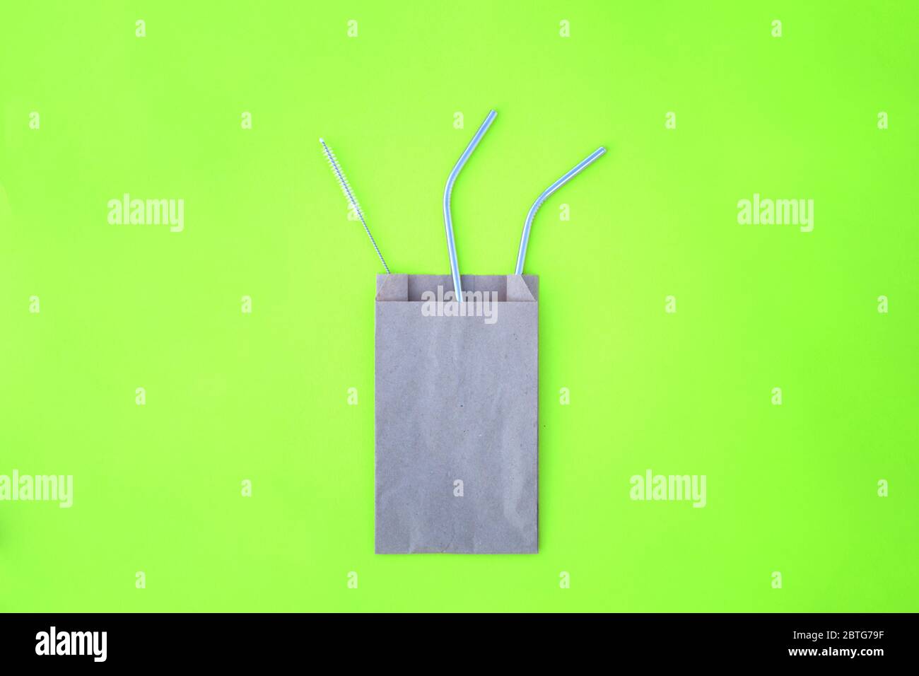 The beautiful metal straw and the brush for cleaning it for party sustainable goods Stock Photo