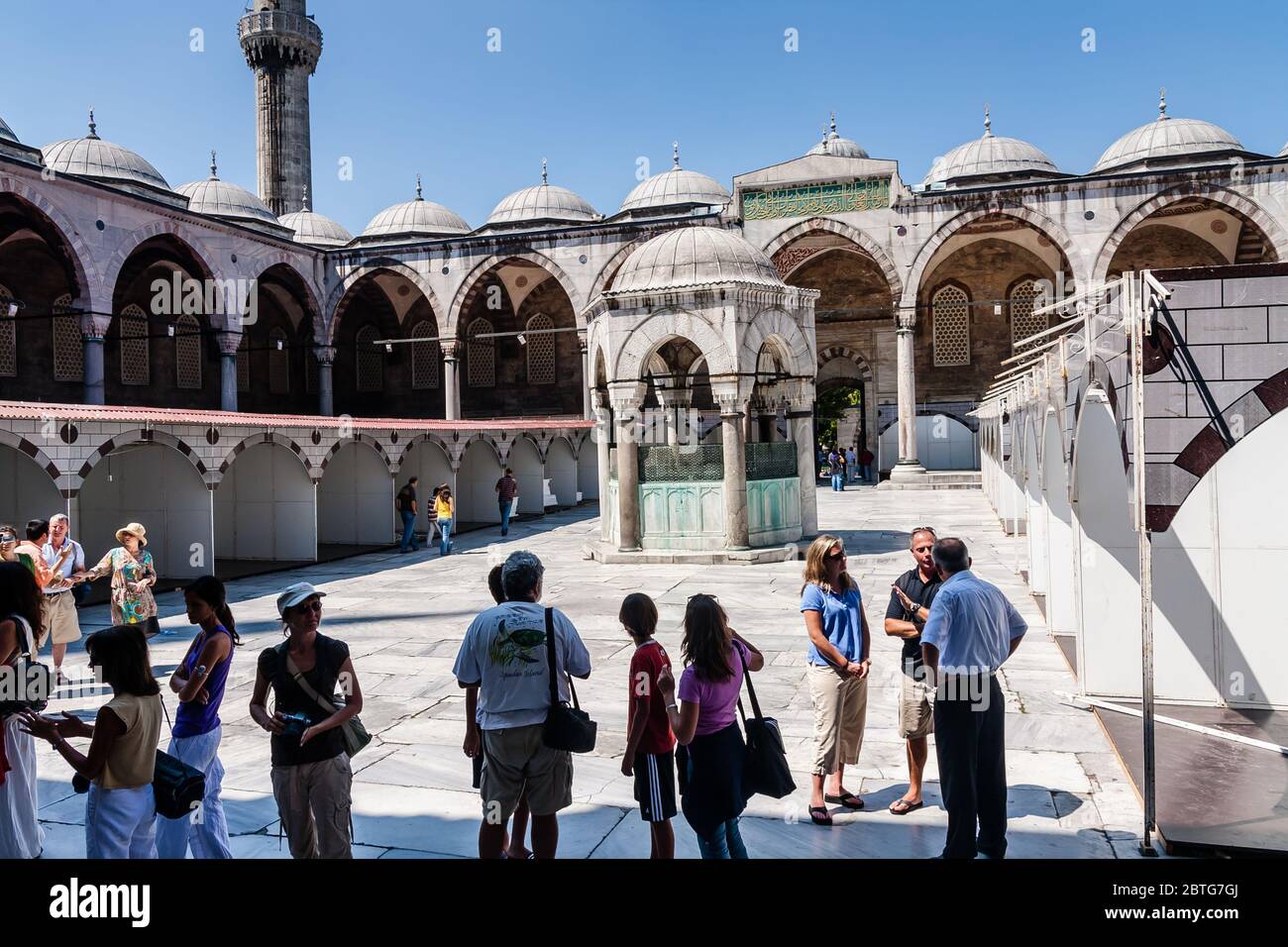 Tourists in the courtyard of Sultan Ahmed Mosque (Blue Mosque), Istanbul Stock Photo