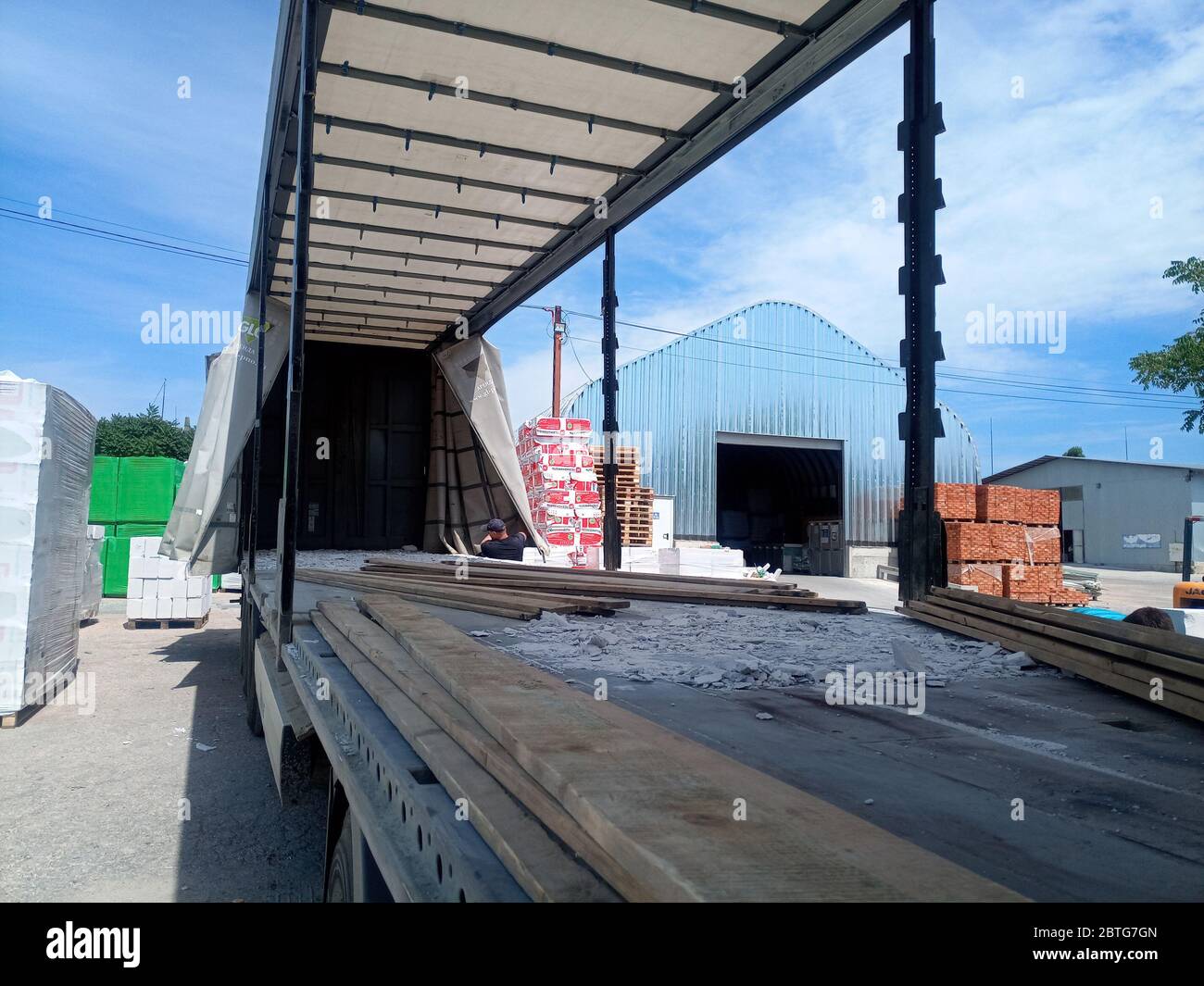 Warehouse of building materials. a Building base, metal, wood and ...