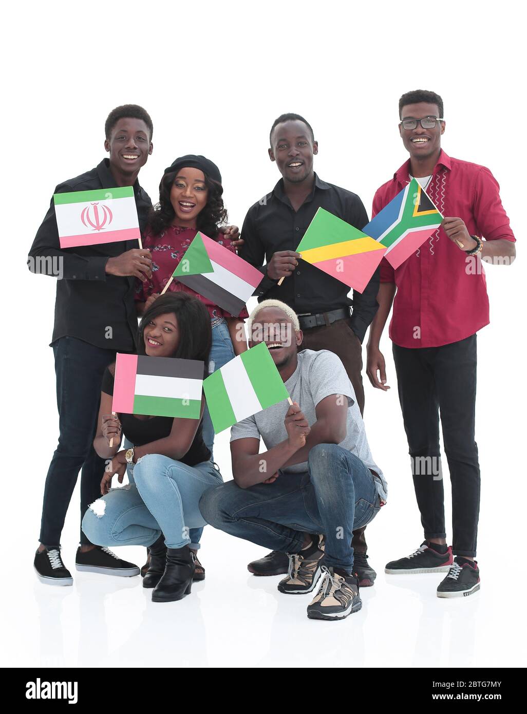Group of friends with flags over white background Stock Photo - Alamy