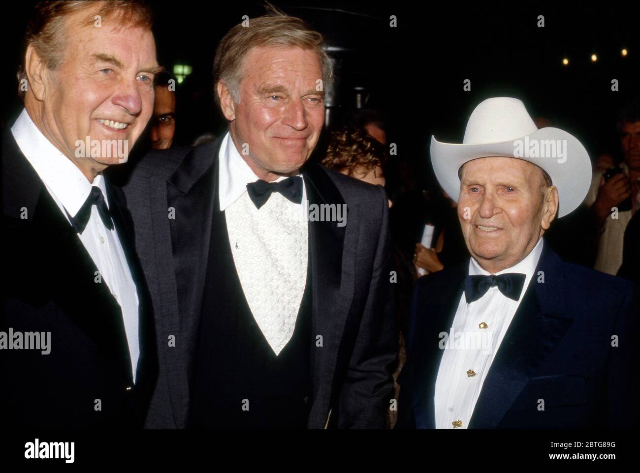 George Montgomery, Charlton Heston, and Gene Autry at event at the Gene Autry Museum in Los Angeles, CA circa 1990. Stock Photo