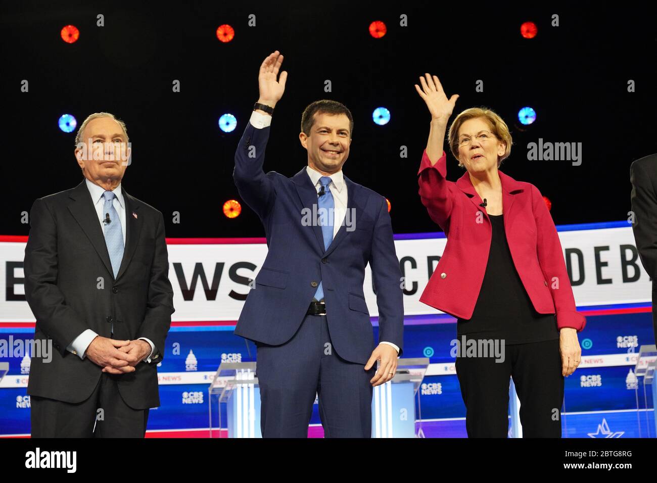 Billionaire Mike Bloomberg, left, Mayor Pete Buttigieg, and Sen. Elizabeth Warren, right, on stage at the start of the CBS News Democratic Debate at the Gaillard Center February 25 2020 in Charleston, South Carolina. The seven Democratic candidates face off before next weeks Democratic Primary in South Carolina. Stock Photo