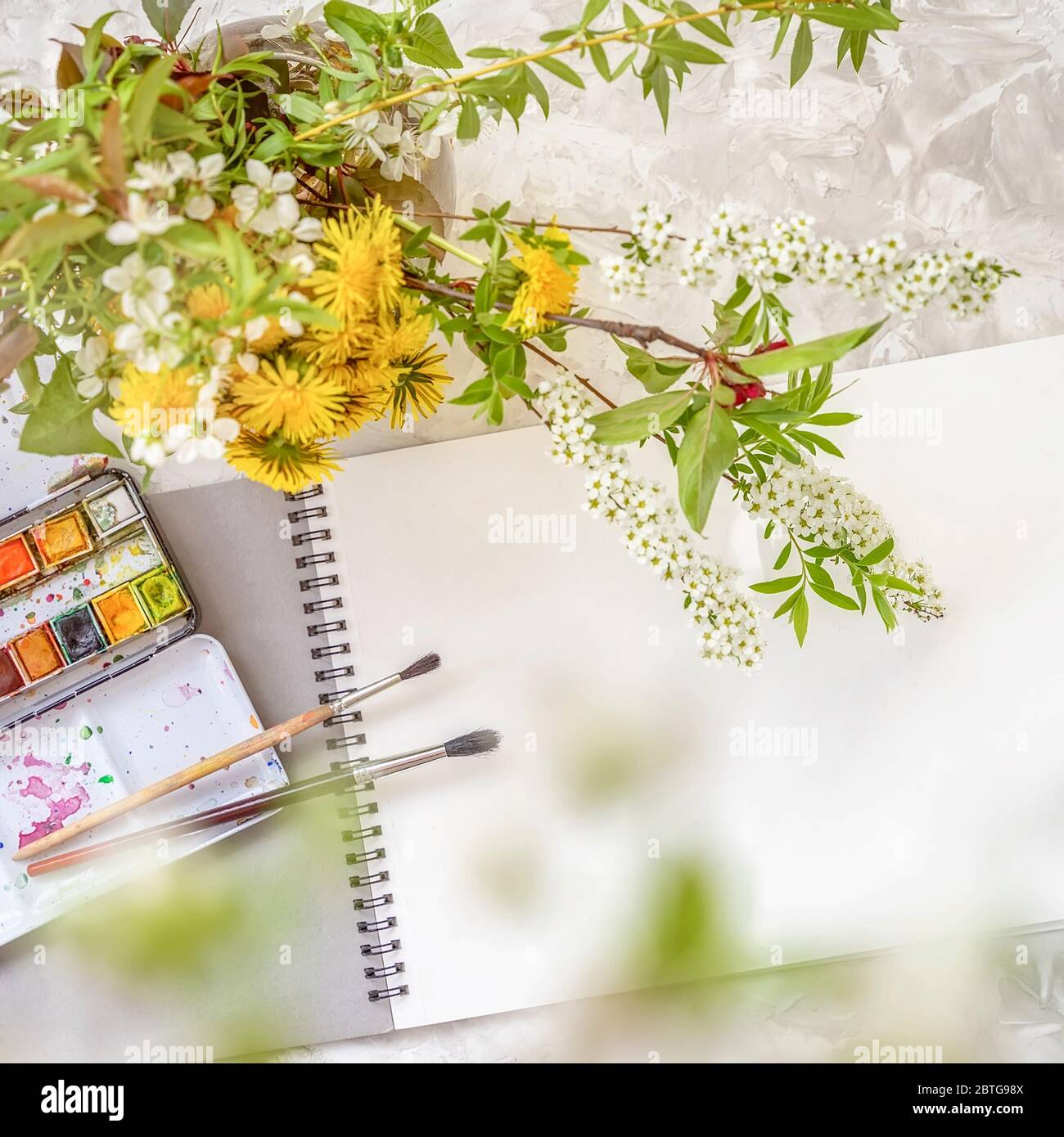 Open sketchbook with watercolor paints and brushes on dark wooden  background, An open notebook on the table top view, AI Generated 24570430  Stock Photo at Vecteezy