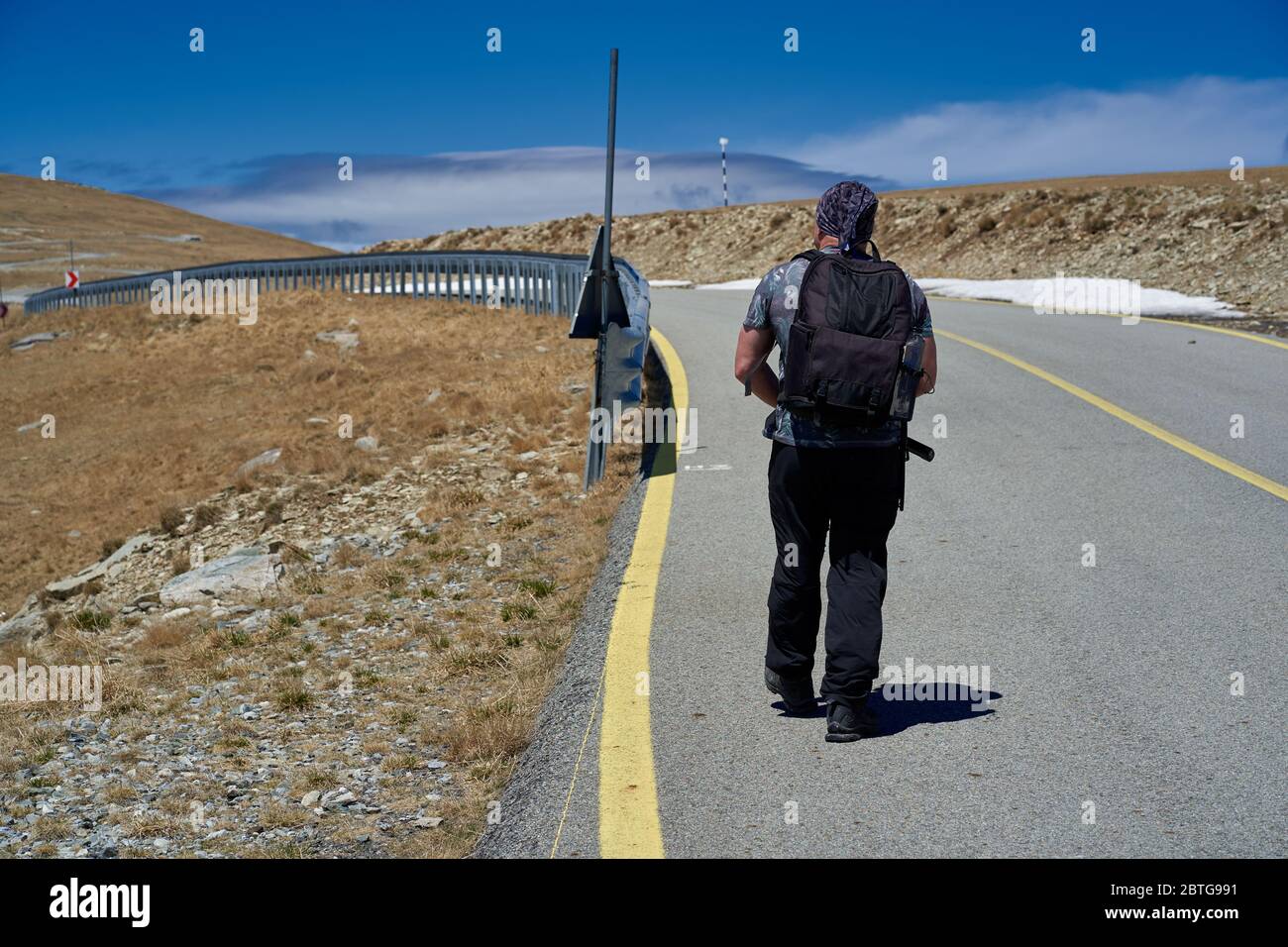 Tourist with camera hiking on a mountain trail Stock Photo - Alamy