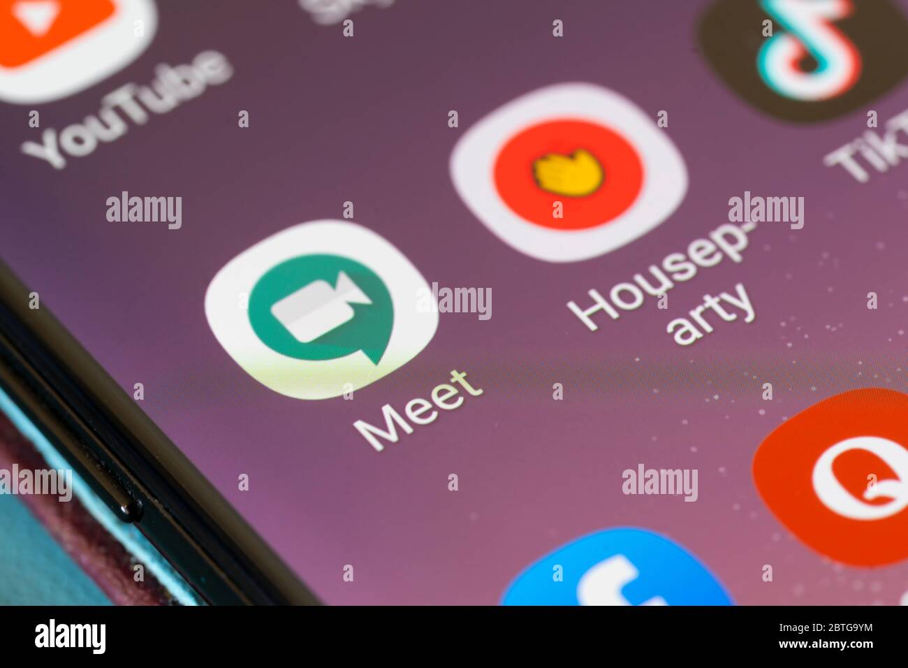 A closeup on a smartphone screen for the Google Meet application logo - a secure video conferencing app Stock Photo