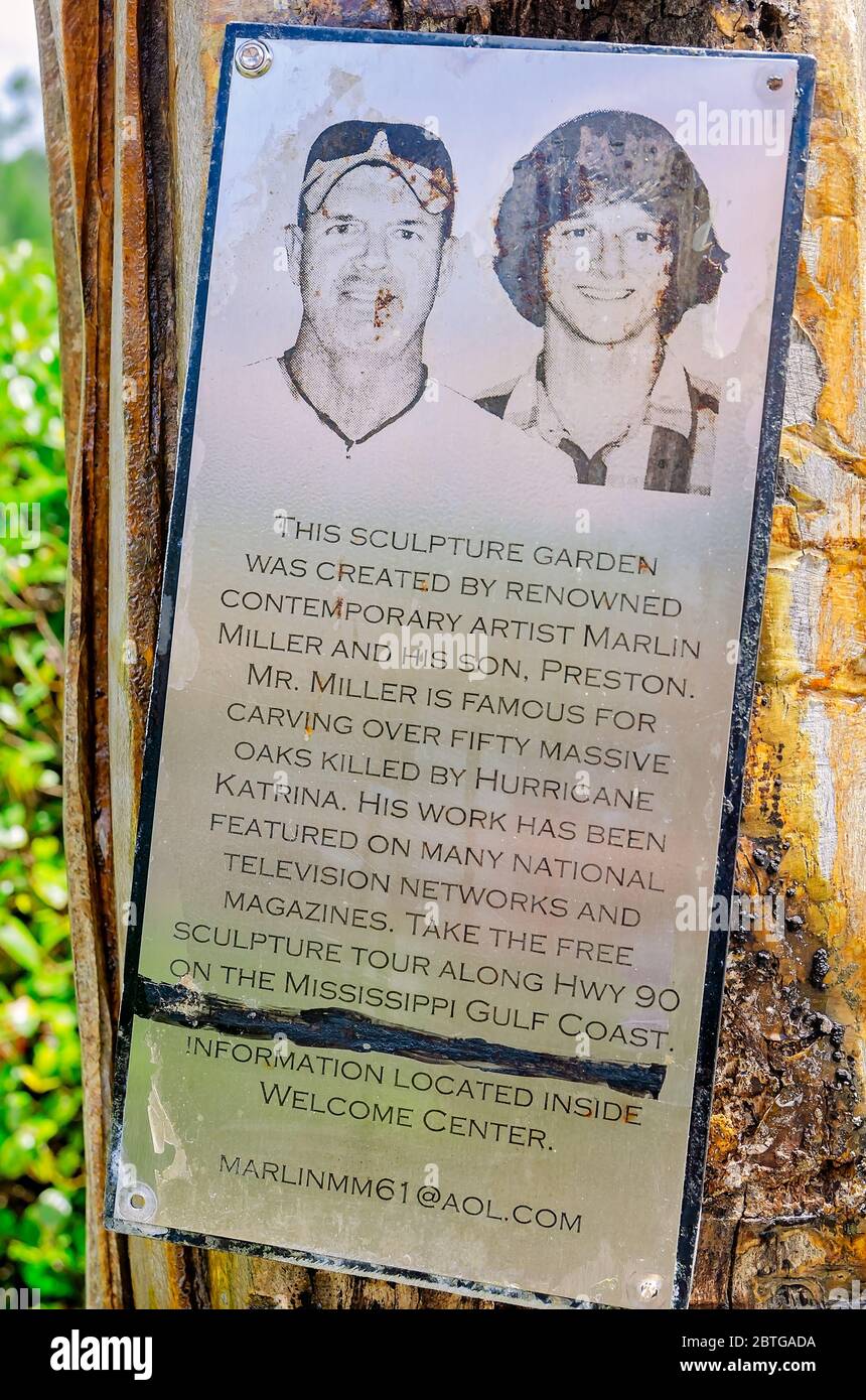 A sign is dedicated to chainsaw artists Marlin Miller and Preston Miller in the sculpture garden at the Mississippi Welcome Center in Moss Point. Stock Photo
