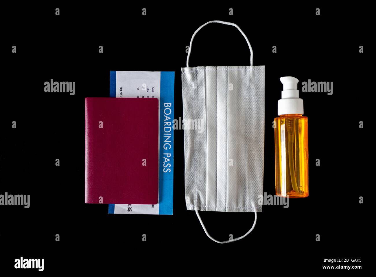 Virus prevention and travel concept during epidemic disease ( Covid-19 ) Protective mask, hand disinfectant,sanitizer, passport and flight ticket Stock Photo