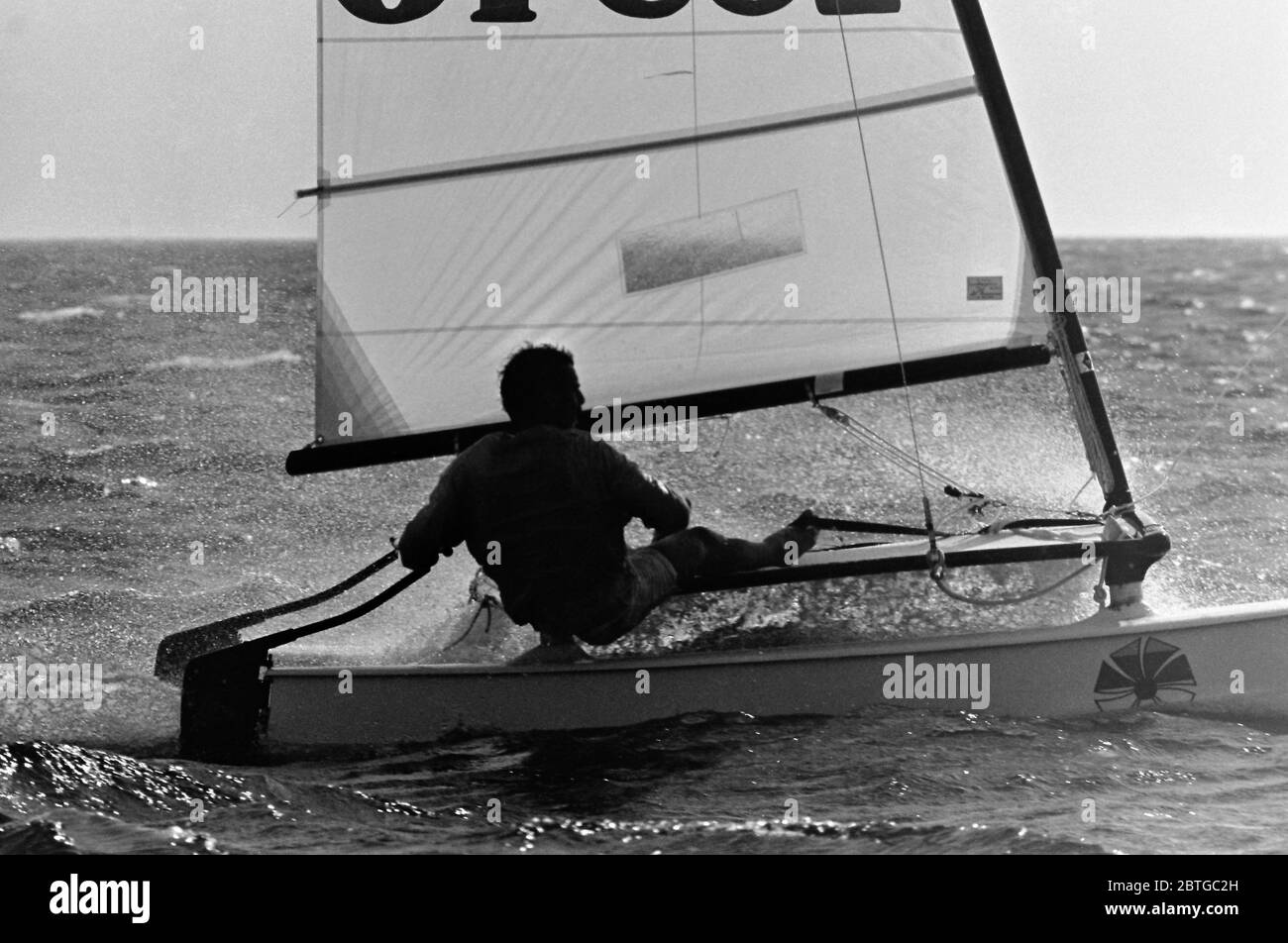 AJAXNETPHOTO. 1977. LAS SALINAS BAY, LANZAROTE, SPAIN. - A COMPETITOR RACING IN A STIFF BREEZE AND CHOPPY WATERS IN THE HOBIE CAT 14 WORLD CHAMPIONSHIPS. PHOTO:JONATHAN EASTLAND/AJAX REF:7726091 34 Stock Photo