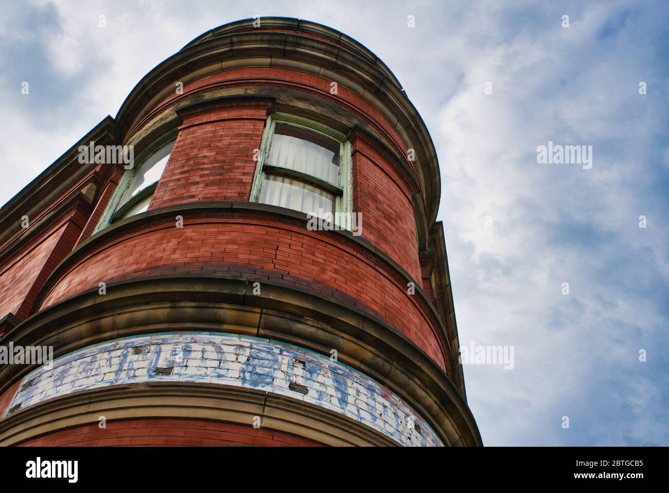 Building detail with cloudy sky background Stock Photo