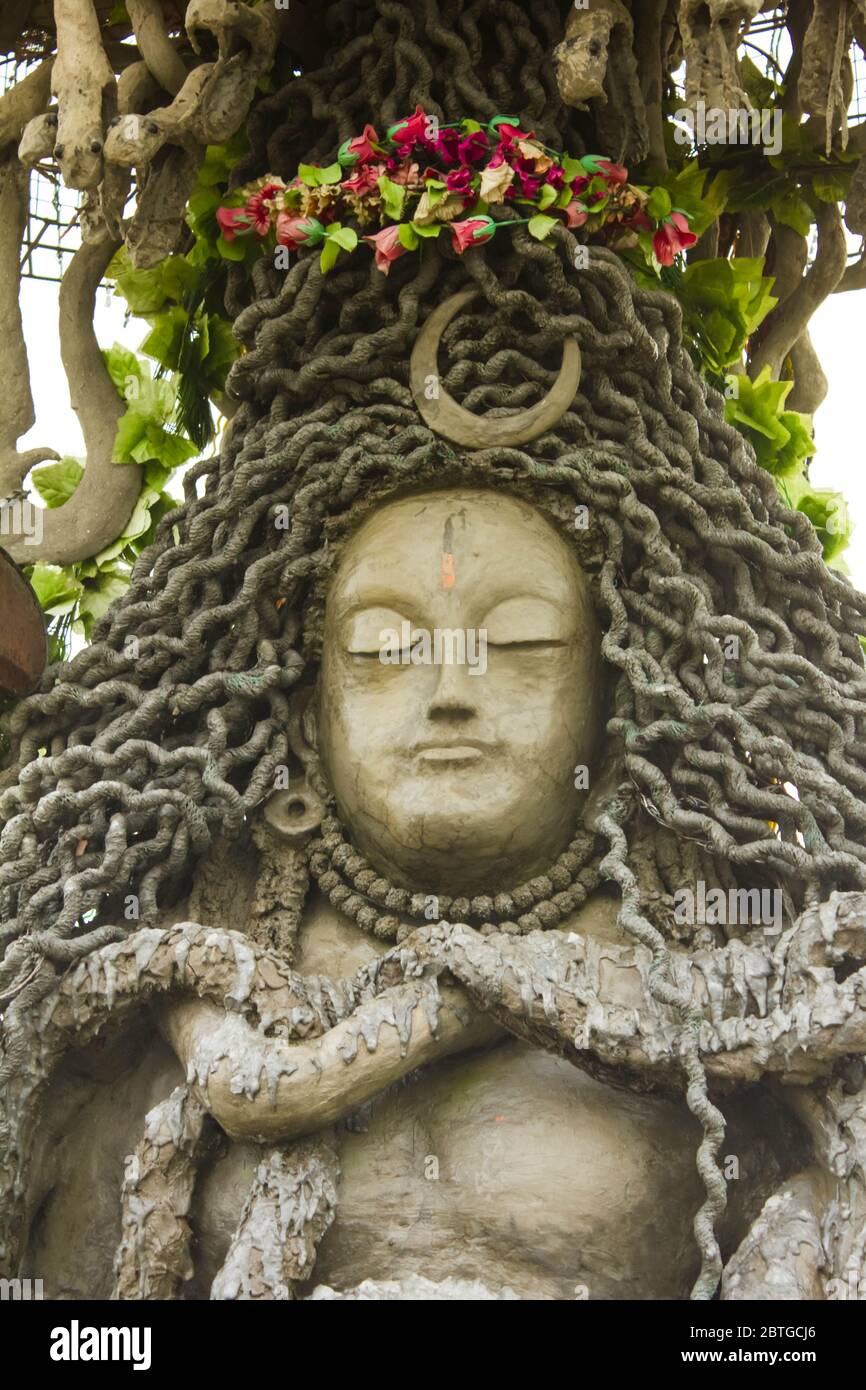 closeup of stoned shiv idol in abandon place in chail, icon of hindu god shiva used to perform puja or prayers, Stock Photo