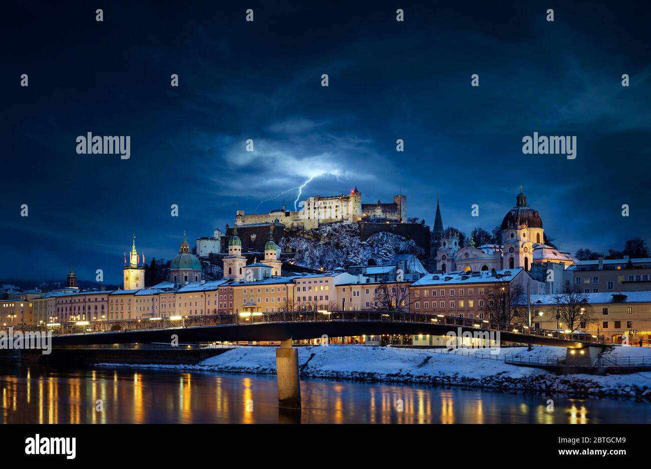 Beautiful view of Salzburg skyline with Festung Hohensalzburg and Salzach river at blue hour, Salzburger Land, Austria Stock Photo