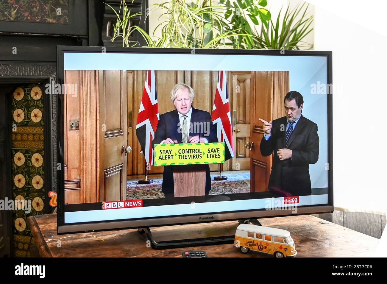 Prime Minister Boris Johnson giving a televised press conference from Downing Street in regard to Covid-19 with 'stay alert, save lives' slogan. Stock Photo