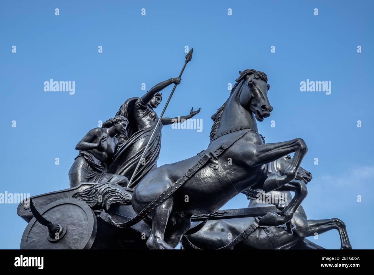 Bronze statue of Boudicca and her daughters riding a chariot pulled by two horses, Westminster Bridge, London, UK Stock Photo