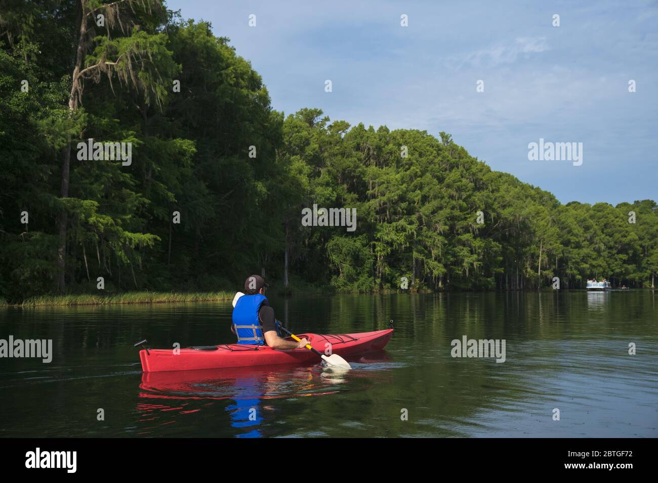Kayaker on the scenic Rainbow River, Dunnellon, Florida Stock Photo