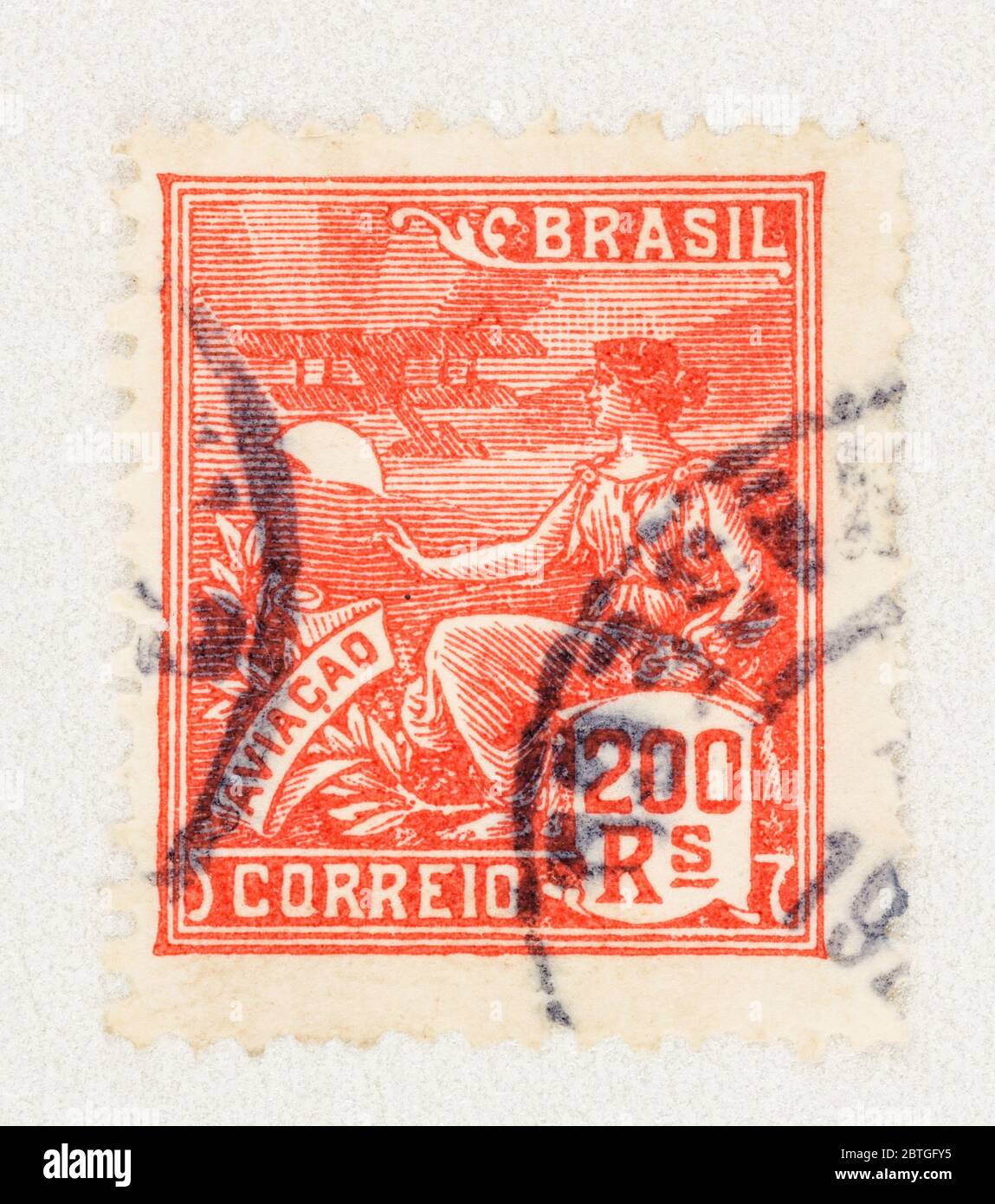 SEATTLE WASHINGTON - May 23, 2020:  Close up 1920s Brazil stamp featuring woman and airplane. Stock Photo