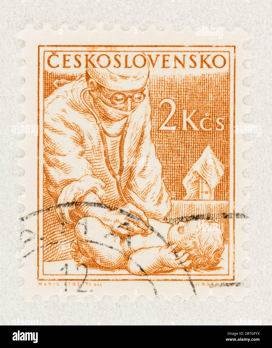 SEATTLE WASHINGTON - May 23, 2020:  Close up Czechoslovakia stamp from 1954 Professions Series, featuring pediatrician and baby. Scott # 655 Stock Photo