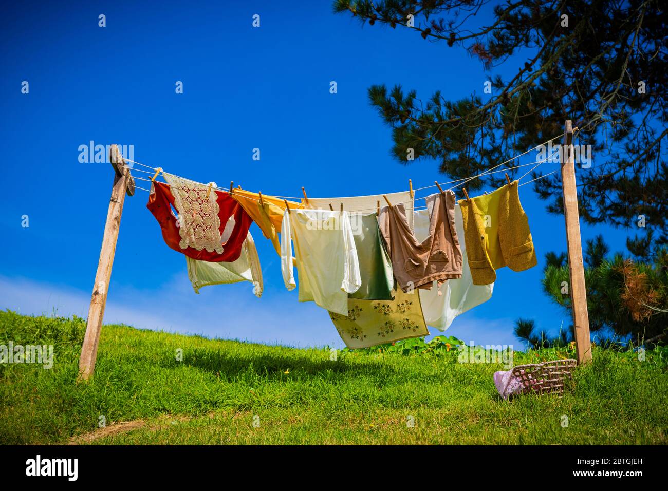 A clothesline in the sun and breeze at the Hobbiton movie set location near Matamata, New Zealand Stock Photo