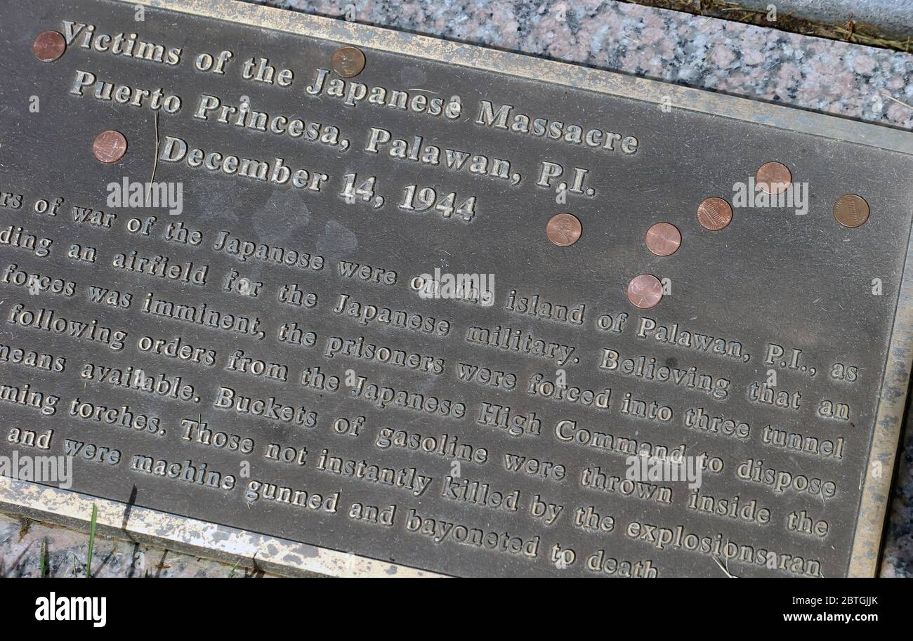 Lemay, United States. 25th May, 2020. The mass grave site of victims pf the Japanese Massacre Puerto, Princesa, Palawan, P.I., has pennys sprinkled on the placard in Jefferson Barracks National Cemetery on Memorial Day, Monday, May 25, 2020. Photo by Bill Greenblatt/UPI Credit: UPI/Alamy Live News Stock Photo